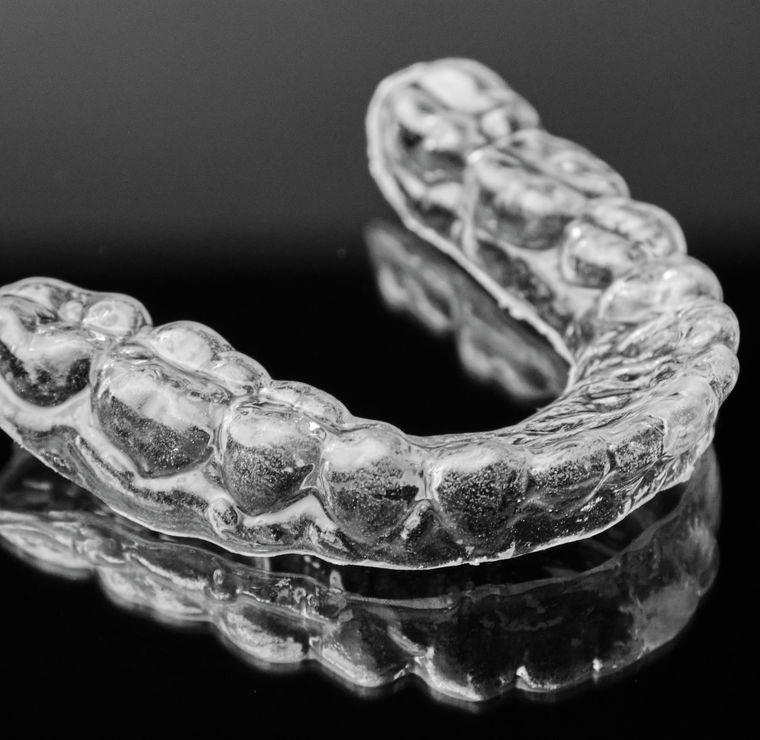 Clear aligner retainer